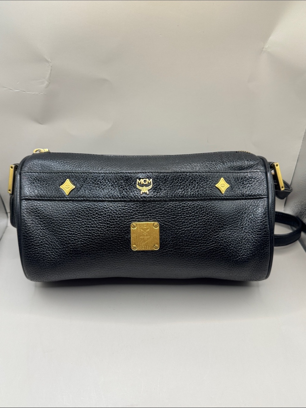 MCM Germany Vintage Black Pebbled Leather Barrel Crossbody Bag with Gold Accents